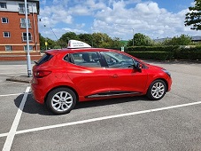 Driving Lessons car behind wheel