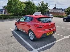 Driving Lessons car behind wheel